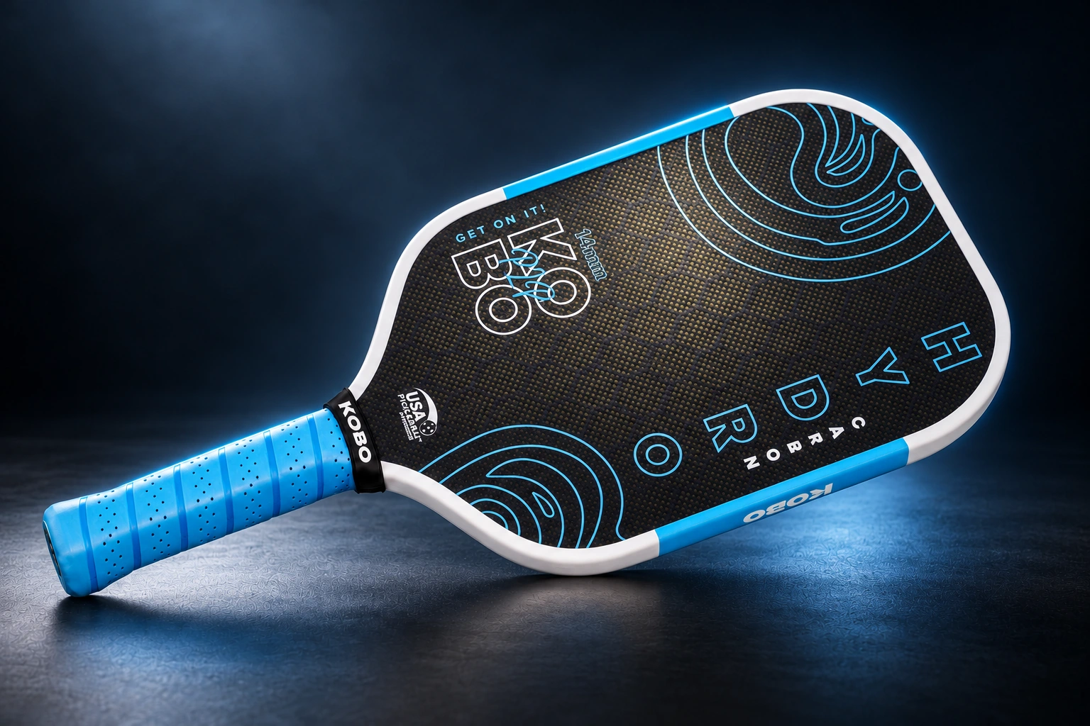 KOBO Hydro G4 14mm paddle shown diagonally against a dark studio background, with lighting highlighting its woven face, white edge guard and blue grip.