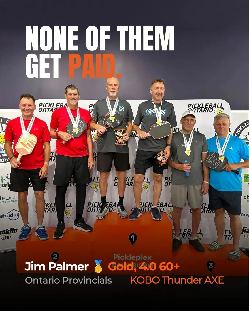 Customers on a tournament podium with paddles and medals