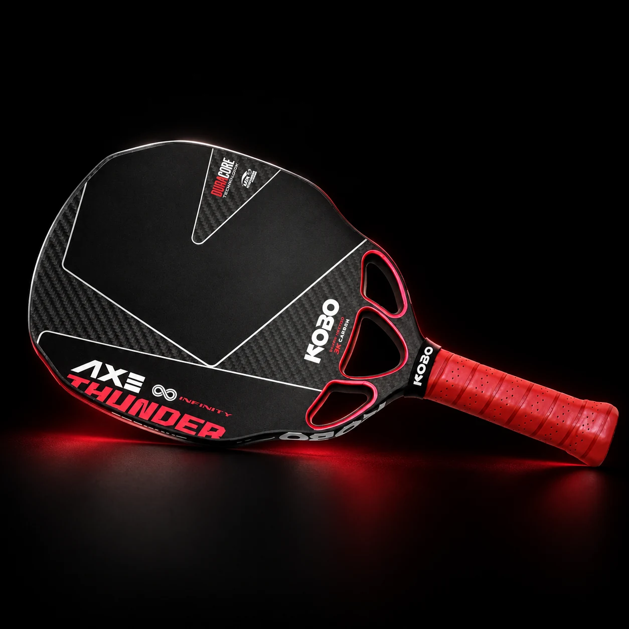 KOBO Thunder AXE pickleball paddle with three red-rimmed air channels, a black carbon face and red grip on a black background.